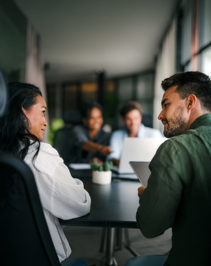 team discussing work together in meeting